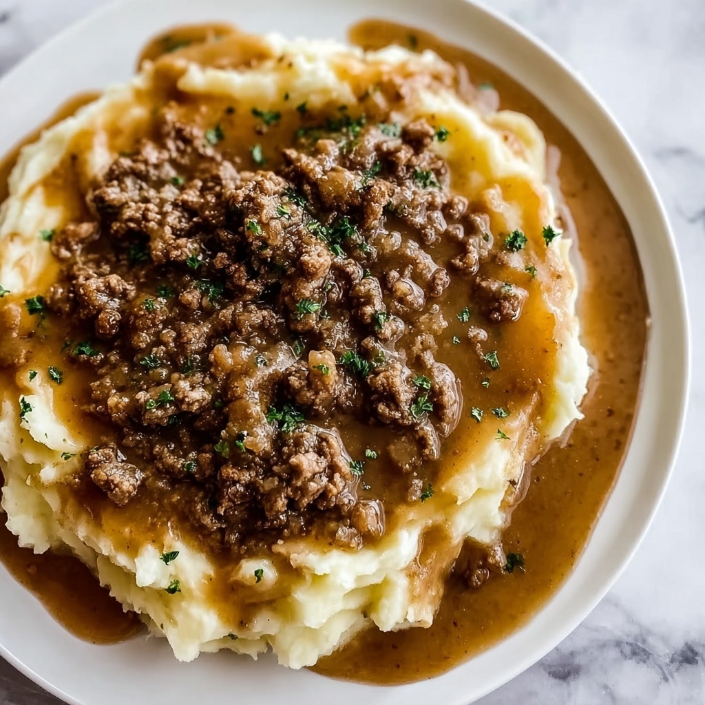 Ground Beef and Gravy Over Creamy Mashed Potatoes Recipe - Recipe Image
