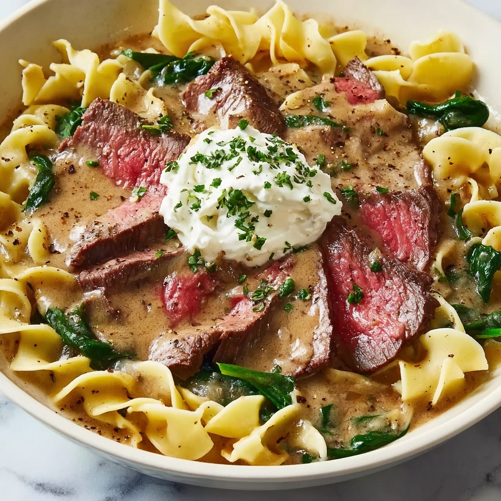 Garlic Butter Steak with Egg Noodles and Spinach Salad Recipe - Recipe Image