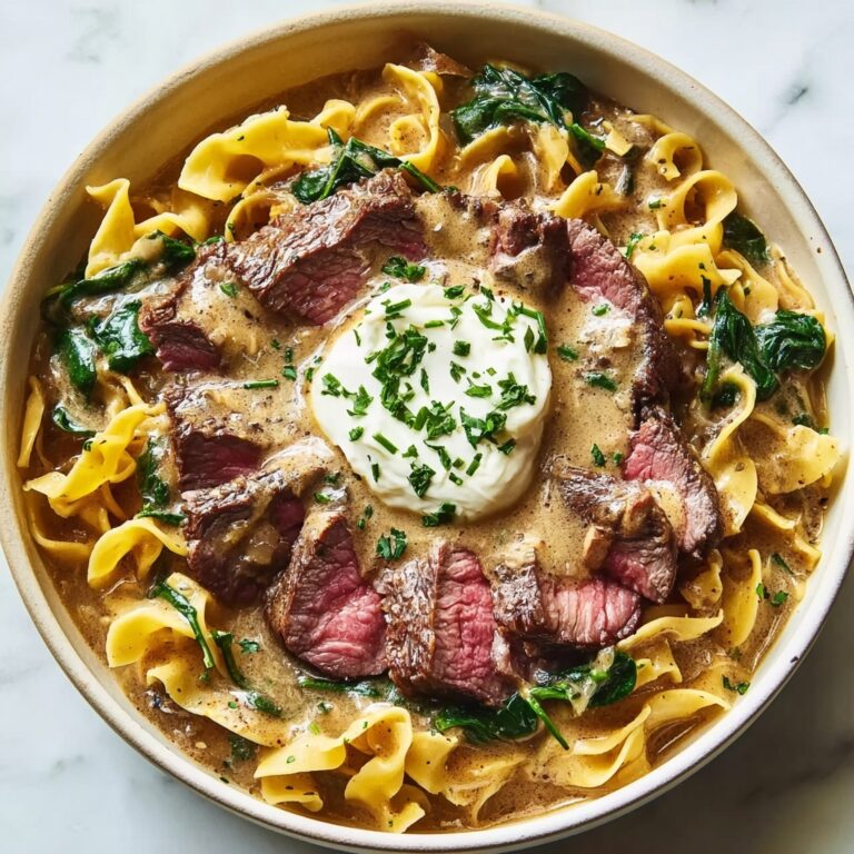Garlic Butter Steak with Egg Noodles and Spinach Salad Recipe